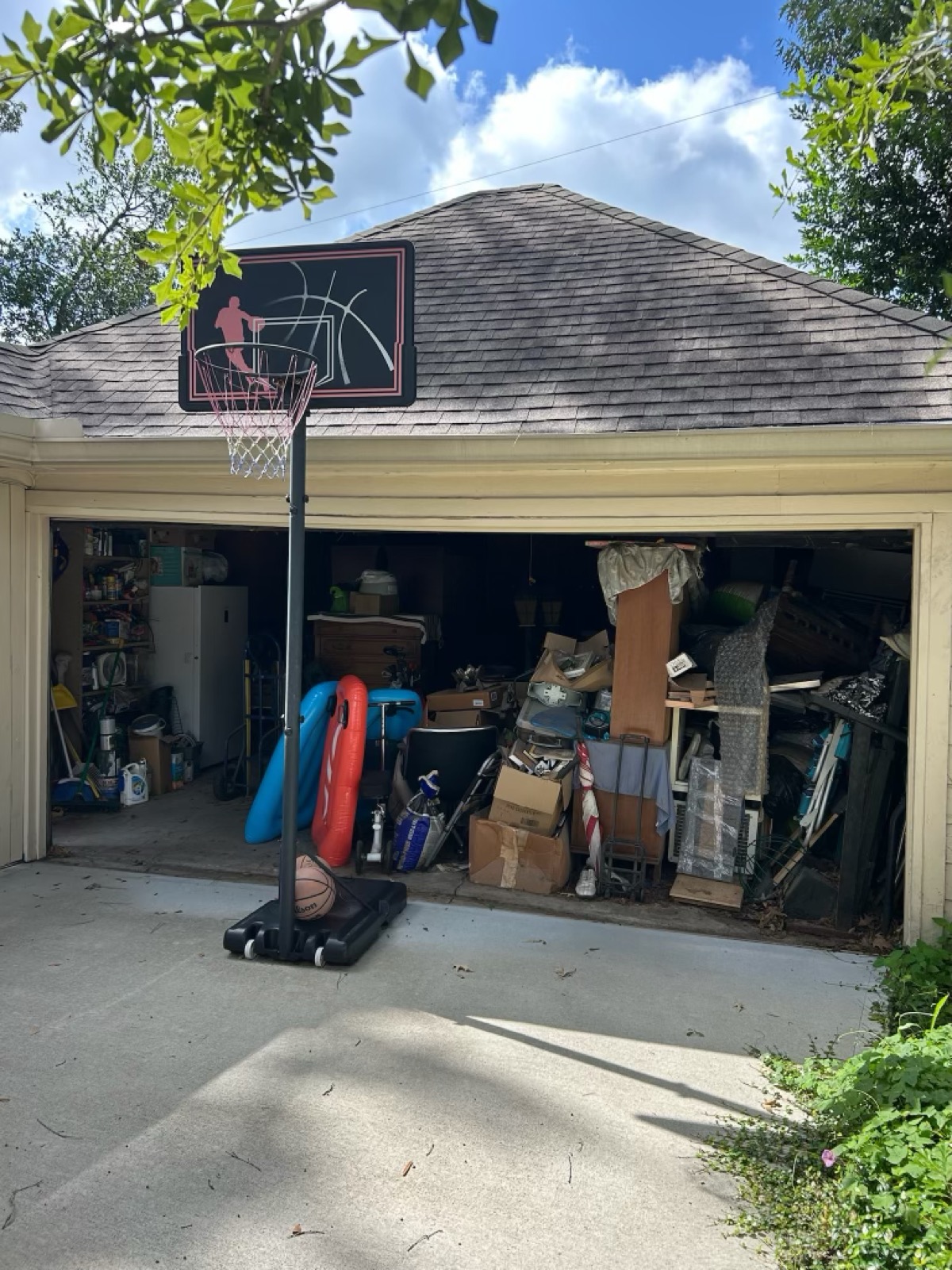 Garage packed with junk before cleanout